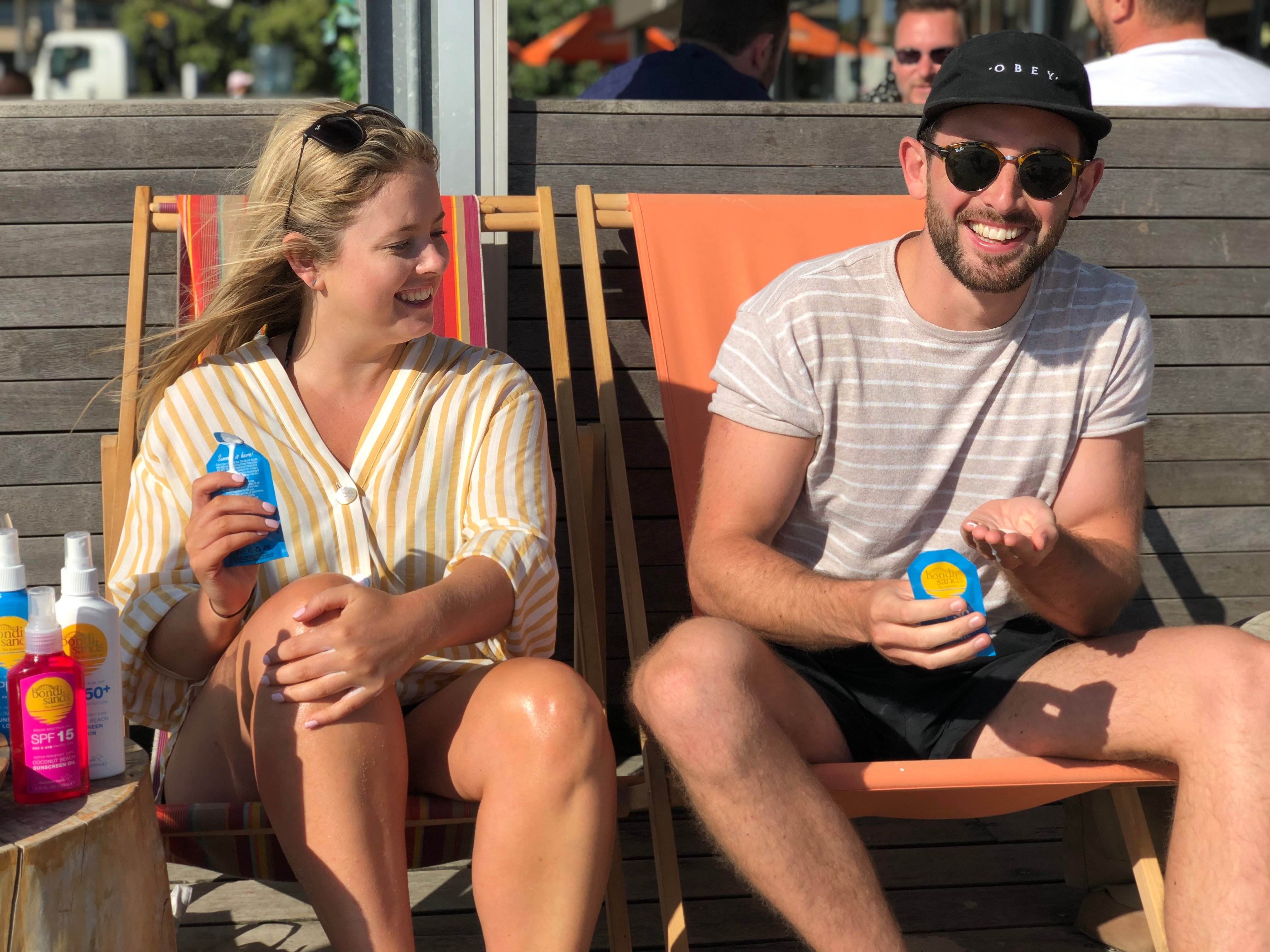 Two guest at the West Beach Pavilion enjoying their Bondi Sands Sunscreen